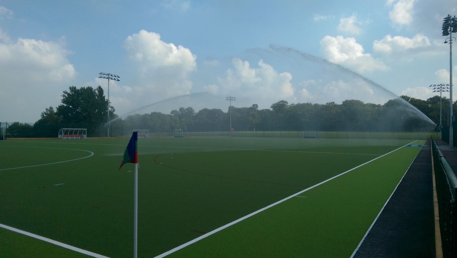 football pitched being sprayed with water