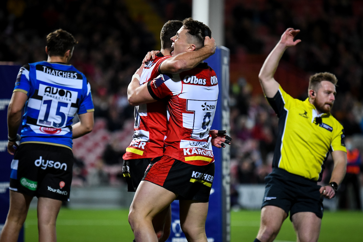 players embracing over win during rugby game