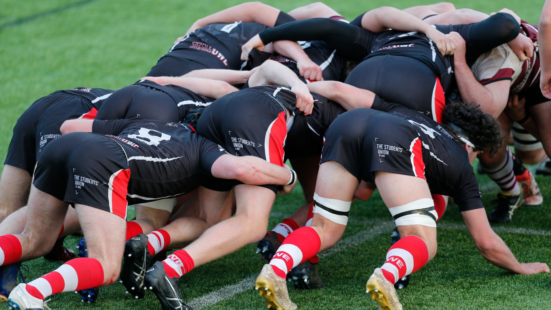 a rugby scrum of around 15 players